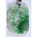 A Chinese carved and pierced mutton fat jade pendant, decorated flowers and foliage, 6.5 cm high x