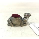 A silver plated camel pincushion