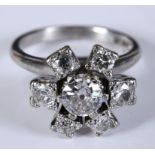 An 18ct white gold and diamond flowerhead cluster ring, approx. ring size M½ Report by RB High set