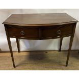 A George III style bow front mahogany table, having two frieze drawers, on tapering square legs with