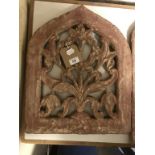 A Mughal sandstone panel, of lancet form, with floral decoration, 41 cm wide