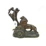 A painted cast metal novelty money box, in the form of a monkey and infant feeding a lion, 24 cm