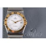 A gentleman's stainless steel and gold Omega Constellation wristwatch, with centre seconds and date,