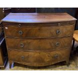 An early 19th century bow front mahogany dressing chest, having a brushing slide above three