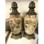 A pair of Japanese Satsuma pottery lamps, with brass mounts, 39 cm high (2) no visible chips, cracks