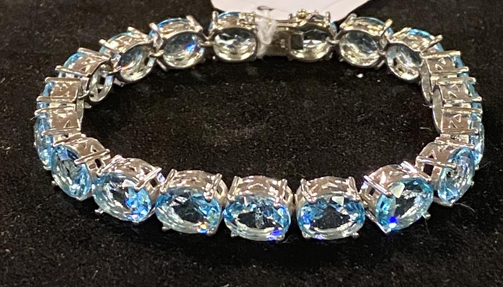 A modern silver coloured metal and topaz bracelet Report by JS Note: this is 20th/21st century