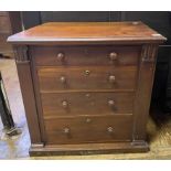 A mahogany chest, of four graduated long drawers, flanked by columns, cut, 72.5 cm wide