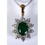 An 18ct white and yellow gold oval emerald and diamond cluster pendant, on a silver chain, emerald