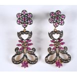 A pair of ruby and diamond drop earrings