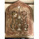 A Mughal red sandstone panel, of lancet form, decorated vessels and rosewater sprinklers, probably