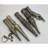 An Indian silver coloured metal hookah mouthpiece, in the form of an elephant, 12 cm, and four other