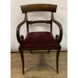 A 19th century mahogany carver chair, on sabre legs