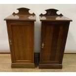 A pair of late Victorian walnut bedside cupboards, 38.5 cm wide (2)