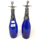 A pair of modern blue glass and decanters, with grape and vine plated mounts, 34 cm high (2)