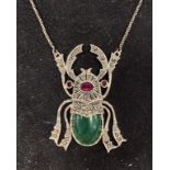 A silver scarab beetle necklace Report by RB Modern