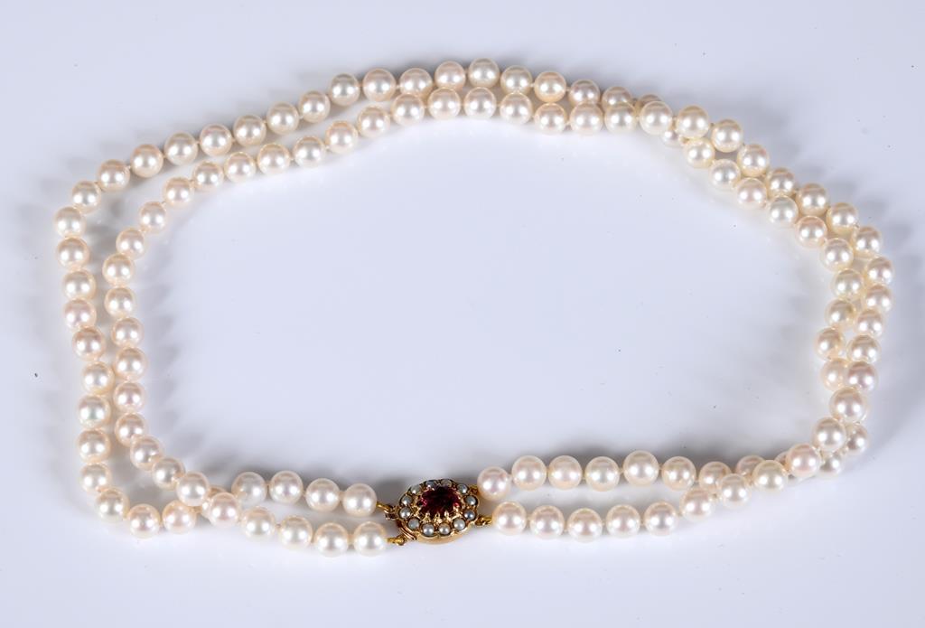 A two row graduated cultured pearl necklace, with a 9ct gold clasp