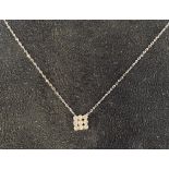 A white gold diamond pendant, on a chain