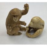 A Japanese carved ivory monkey, 8 cm, and another, 4 cm