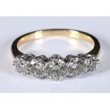 An 18ct white and yellow gold five stone graduated diamond ring, approx. 1.46ct