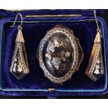 A pair of late Victorian inlaid tortoisehell pendant earrings and a matching brooch, in a later box