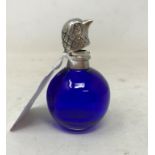 A modern blue glass scent bottle, with mounts in the form of a bird's head, 5 cm high Report by JS