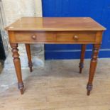 A 1970s mahogany side table, having two frieze drawers, on turned tapering legs, 34 cm