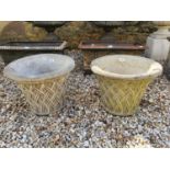 A pair of composition stone garden urns, 45 cm diameter