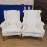 A pair of wing back arm chairs (2)