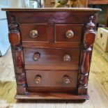 A mahogany chest, of small proportions, having two short and two long drawers, 22 cm high x 46 cm