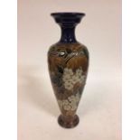 A Royal Dolton stoneware vase, decorative flowers, impressed mark to base, 43 cm high Very shallow