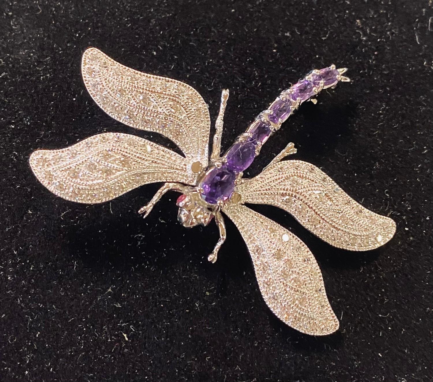 A silver and amethyst dragonfly brooch Modern