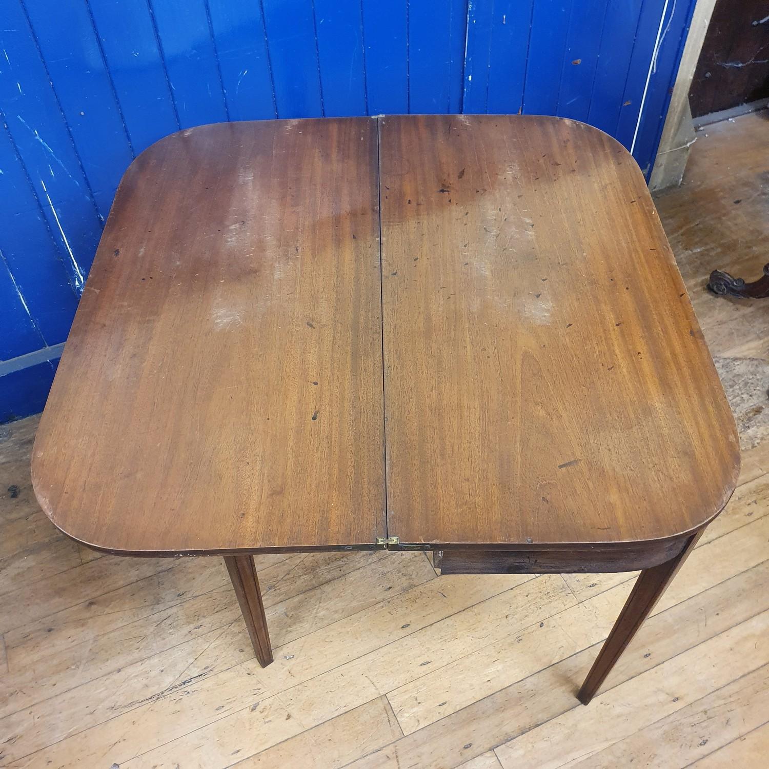 A 19th century mahogany folding tea table, 89 cm wide Top very faded from sun damage - Image 4 of 4