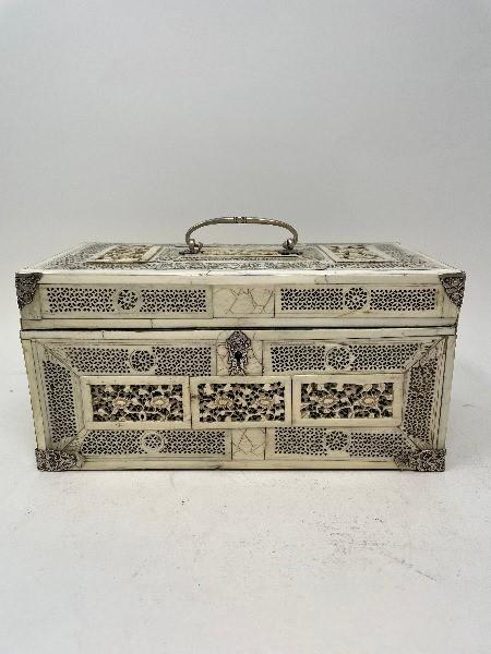 A late 19th century Chinese ivory mounted tea caddy, carved and pierced flowers and foliage, with