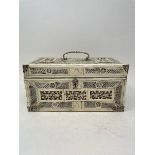A late 19th century Chinese ivory mounted tea caddy, carved and pierced flowers and foliage, with