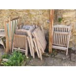 A set of six teak folding garden chairs, with green cushions, and three deck chairs (9)