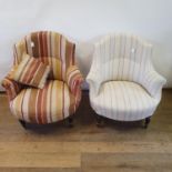 A pair of early 20th century armchairs, on turned tapering legs, upholstered in different fabric (2)