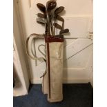 Thirteen early 20th and later golf clubs, and bag (14)