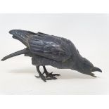 A Japanese bronze figure of a crow, 18 cm wide The crow is missing its two outer claws and has light