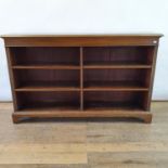 A mahogany bookcase, with adjustable shelves, on bracket feet, 103 cm high x 162 cm wide