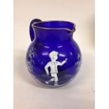 A Mary Gregory style blue glass jug, 18 cm high, an opaque glass vase, painted flowers, 35 cm