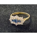 An 18ct gold, sapphire and diamond cluster ring