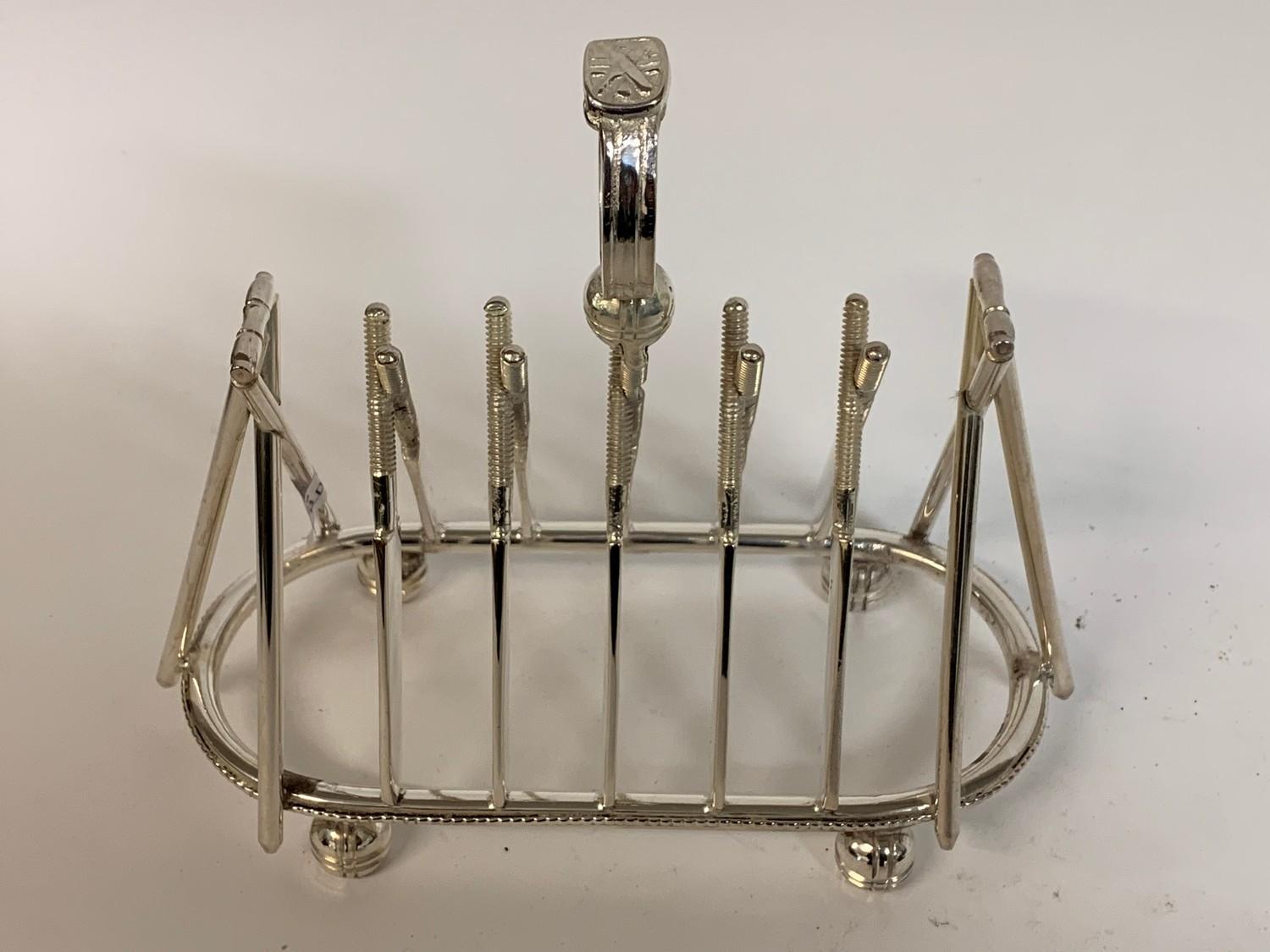 A novelty plated cricketing toast rack, 16.5 cm high Modern