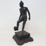 An Mg Po Kyaw, Pegu, bronze figure, of a Chinlong player, on a carved wooden base, 20 cm high