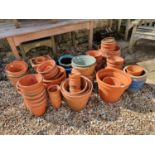 A terracotta garden planter, 40 cm diameter, various other terracotta planters, pots, and a metal