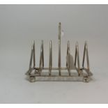 A Dr Christopher Dresser style toast rack, 15 cm high Modern