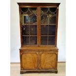 A mahogany bookcase cabinet, top having two glazed doors, on a base with two cupboard doors, 205