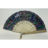 A Chinese carved ivory fan, painted figures, dwellings and foliage, 29 cm, and two other Chinese