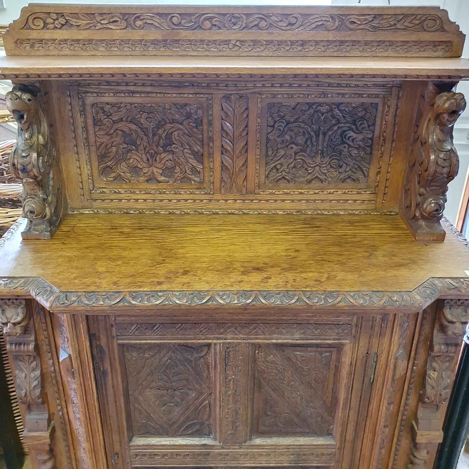 A late 19th century Anglo-Flemish oak cabinet, the raised back above a panel door, carved all over - Bild 5 aus 6