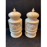 A pair of early 20th century Indian ivory salt and pepper pots, carved Taj Mahal, in a