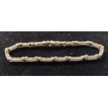 An 18ct white gold and diamond fancy link bracelet